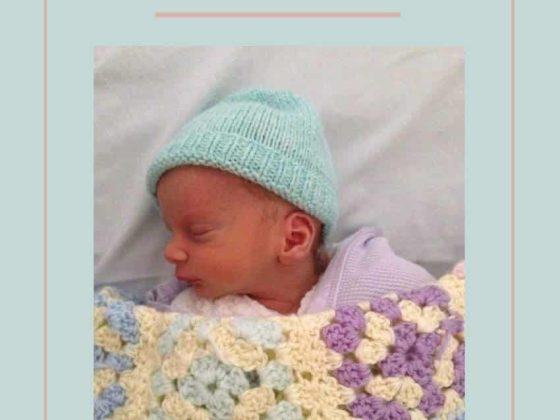 blue book coverLouise Warneford Baby Dreams with a baby in the center, baby is wearing a blue hat and covered by a yellow crohet blanket,