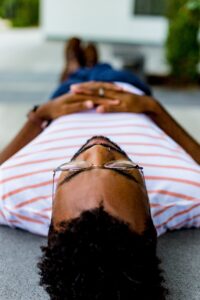 man laying on the ground looking stressed, dear jo 