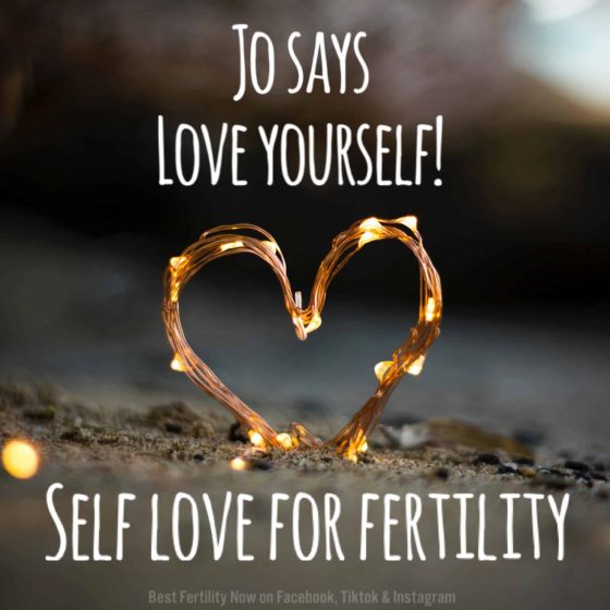 heart made of string light on a barren path with the words jo says love yourself self love for fertility