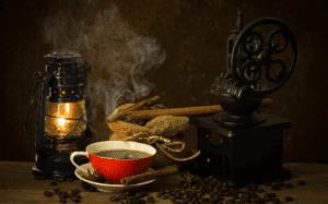 coffe cup red, beans and a lanmp illustrating caffeine causing miscarriages