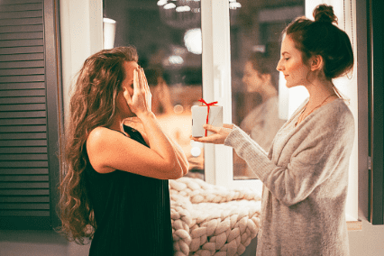 women giving a gift Amazing gift ideas ivf best fertility now