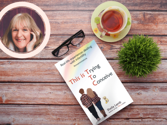 dark wood table with a copy of this is trying to conceive book by sheila lamb, a green plant on the right of the book with a cup of black tea above it, and top left of the page is a circle with the image of Author Sheila Lamb