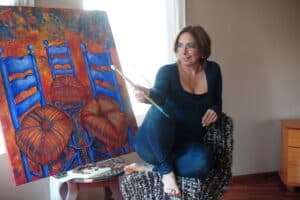 Carmen Martinez Jover painting chairs