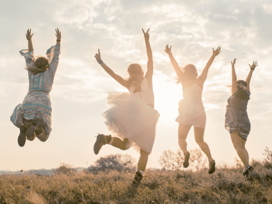 four women juping in the air in celebration, illustratiung dear hopeful ivf friend