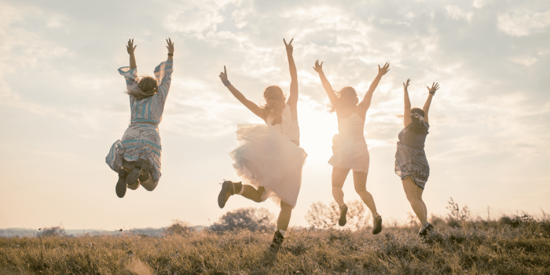 four women juping in the air in celebration, illustratiung dear hopeful ivf friend