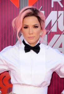 Halsey in a white shirt and black bow tie