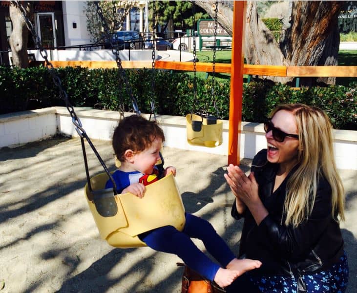 Jules Burke and her son Lorcan on a swing